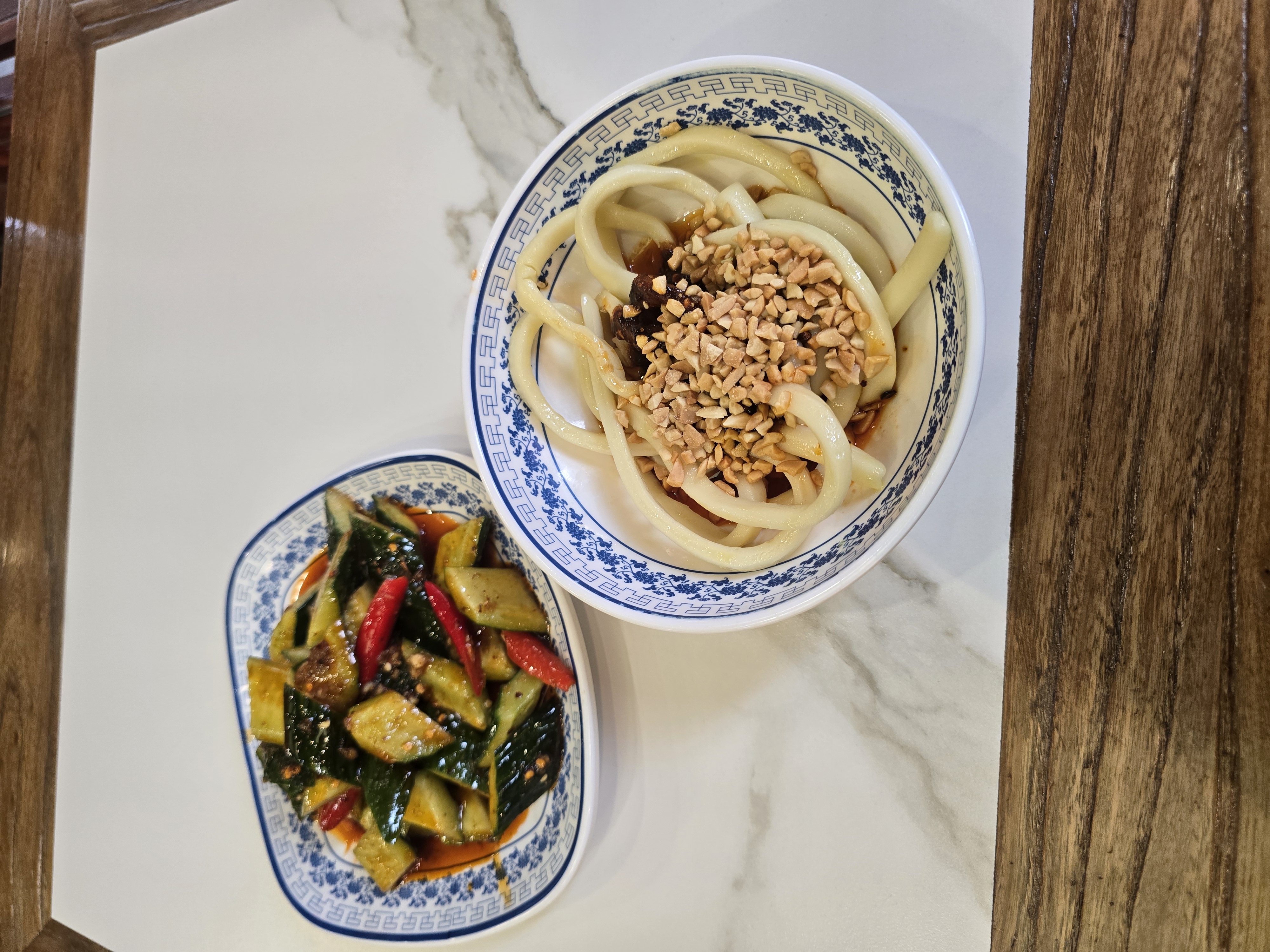 Some lovely Chengdu meals, both dishes has a base of chili oil at the bottom of the bowl.